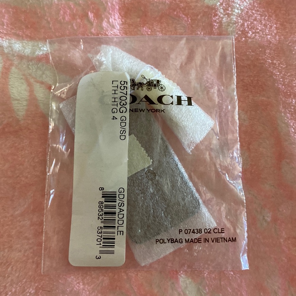 Coach Saddle Leather Stamped Star Hangtag. New in original packaging.